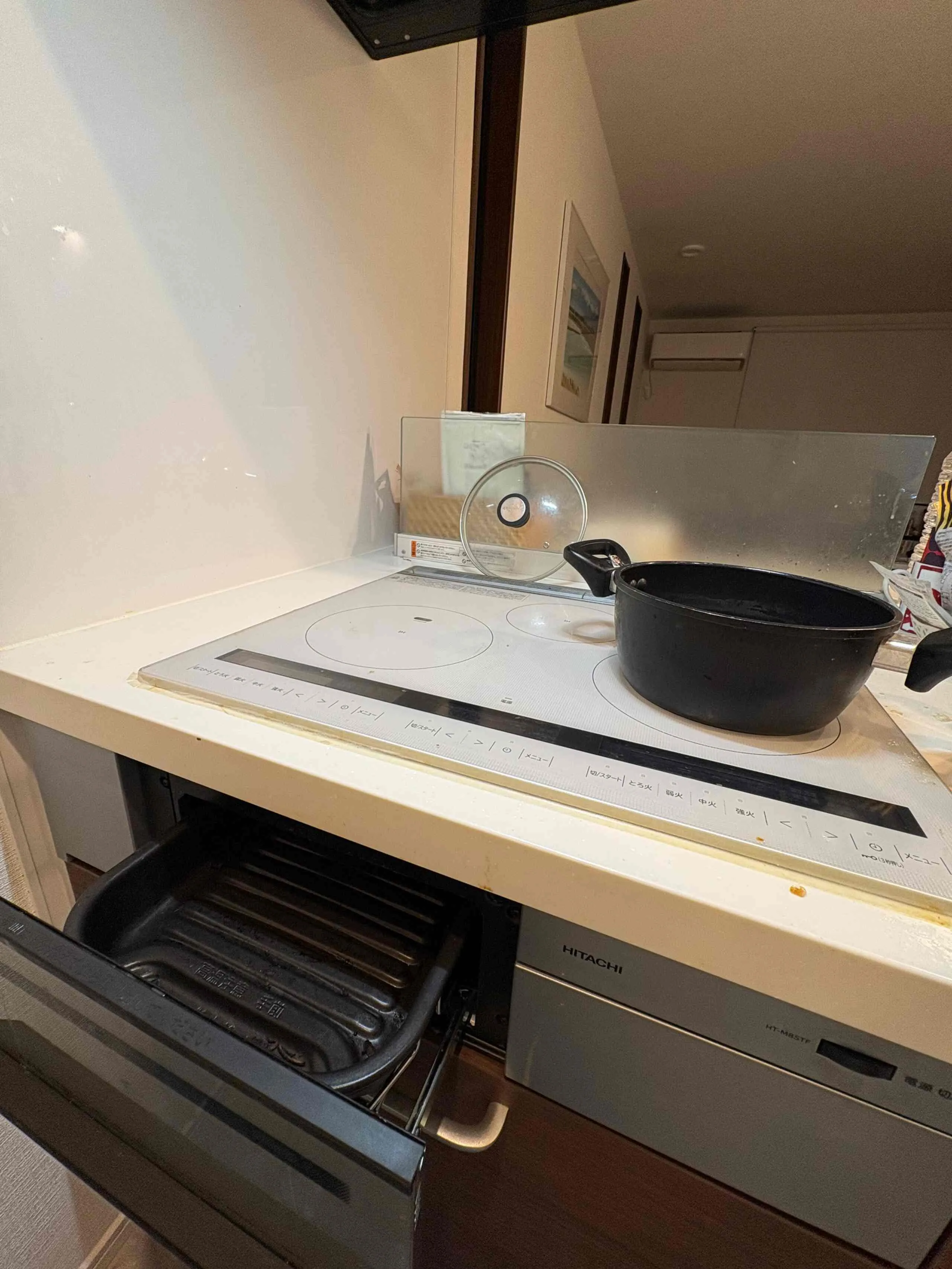 Hitachi induction cooktop with a built-in grill in the shared kitchen.